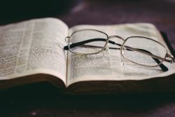 eyeglasses in top of book